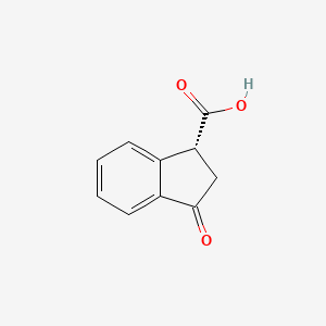 (1R)-3-oxo-2,3-dihydro-1H-indene-1-carboxylic acid - 81702-53-6
