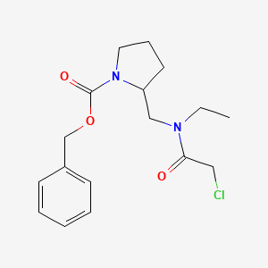 2-{[(2-Chloro-acetyl)-ethyl-amino]-methyl}-pyrrolidine-1-carboxylic acid benzyl ester - 