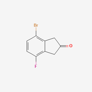 4-Bromo-7-fluoroindan-2-one - 