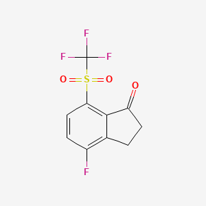 4-Fluoro-7-(trifluoromethylsulfonyl)indan-1-one - 