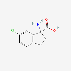 1-Amino-6-chloro-2,3-dihydro-1H-indene-1-carboxylic acid - 
